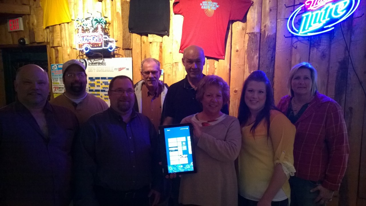 Members of the Fond du Lac Lakeside Evening Kiwanis with owners of Beer Run Tavern.