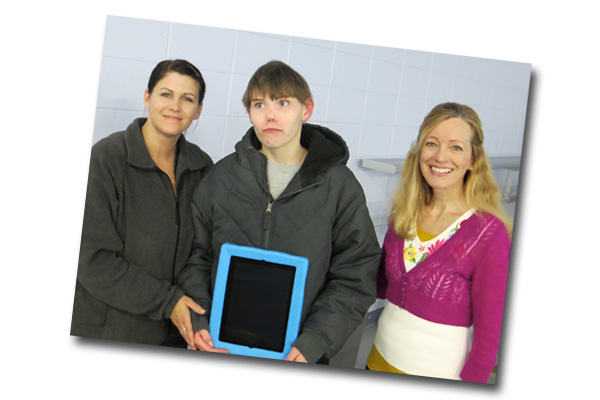 Sam Hofstad receives iPad from Sheboygan Falls Kiwanis Club,